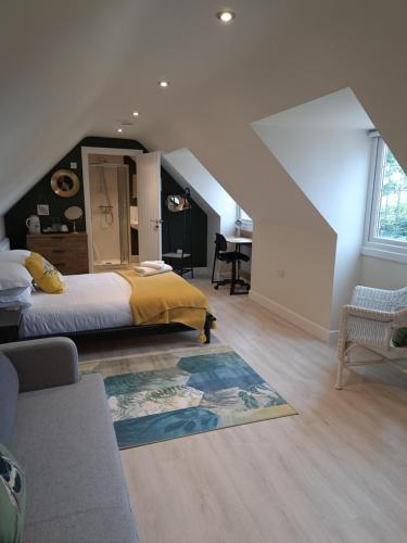 a bedroom with a king sized bed and an attic at The Lookout in Bromsgrove