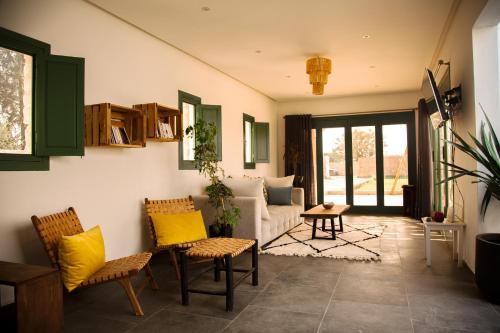a living room with a couch and yellow pillows at WINK house : Charme et Sérénité in Essaouira