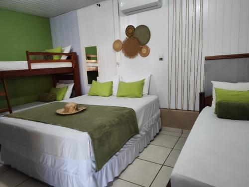 Postel nebo postele na pokoji v ubytování Hotel Coração Verde