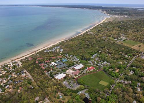 an aerial view of a house next to a beach at The Mansion at Ocean Edge Resort & Golf Club in Brewster