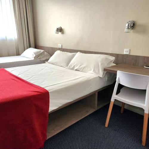 Postel nebo postele na pokoji v ubytování Hotel Arcos