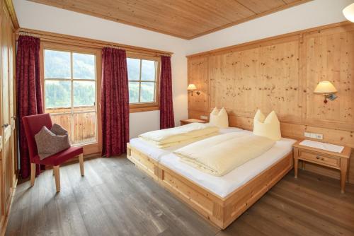Posteľ alebo postele v izbe v ubytovaní Gästehaus Larch