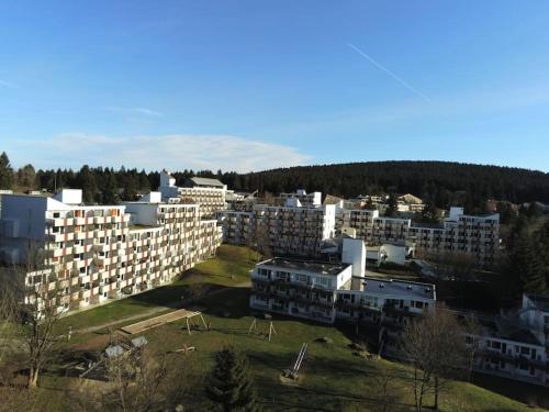 an aerial view of a city with tall buildings at Sauna, Pools mit XXL-Terasse oder Kinderkino in Sankt Englmar