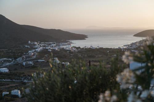 a view of a town and the ocean at Castello Amorgos Suites in Katapola