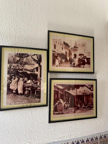 three framed pictures of people on a wall at Casa Medina Sanaa in Tetouan