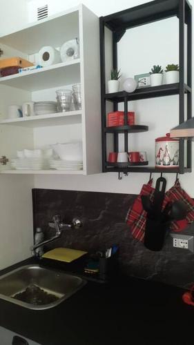 a bathroom with a sink and a mirror and a counter at Ciel Bleu - Cir 0122 in Pila