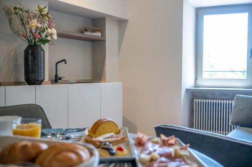 a tray of food on a table with a plate of food at Forma Your Boutique Suite in Corciano