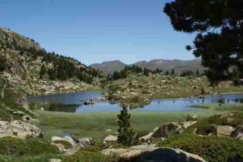a lake in the middle of a mountain at Típica Casa Andorrana en Encamp l by BonesVacances in Encamp