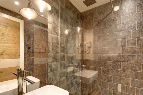 a bathroom with a shower and a toilet and a sink at Vlasinsko jezero VILA BEST in Surdulica