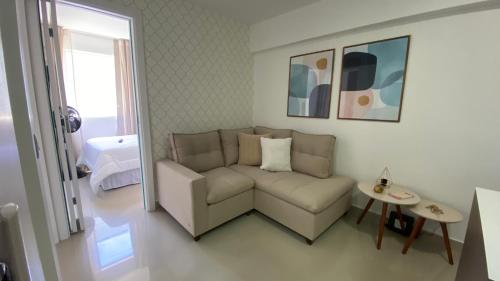 a living room with a couch and a table at Márcia Santos in Curitiba
