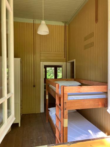 a room with two bunk beds in a house at Casa del Castagno: un nido nel castagneto in Pistoia