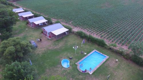 an aerial view of a farm with a swimming pool at Finca Lo de Guarin in Vaqueros
