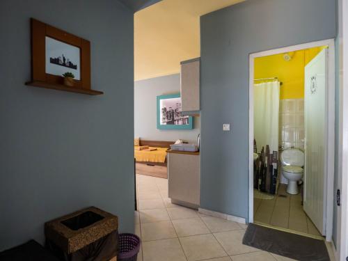 a bathroom with a sink and a toilet in a room at ThassCities Casa Studios in Limenas