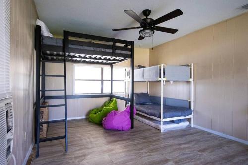 a room with two bunk beds and a ceiling fan at DO NOT RENT IT WONT LET ME TAKE OFF thank you in New Braunfels