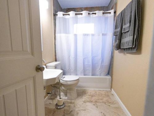 a bathroom with a white toilet and a sink at DO NOT RENT IT WONT LET ME TAKE OFF thank you in New Braunfels