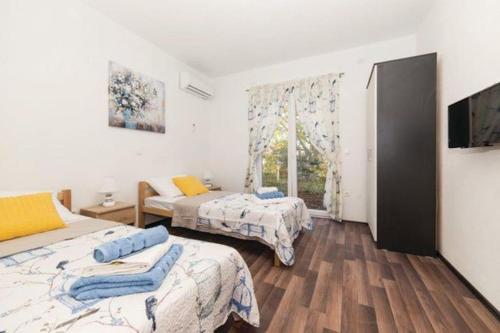 Krevet ili kreveti u jedinici u okviru objekta Villa Olympus -Kaštela, Trogir