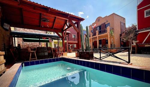a swimming pool in front of a building at West Refugio in San Juan del Río