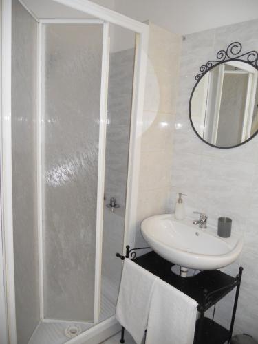 a bathroom with a shower and a sink and a mirror at Sweet Rome B&B in Rome
