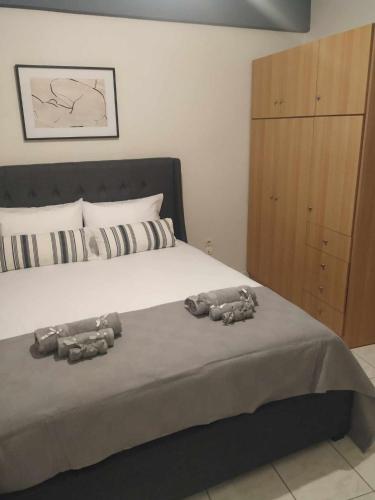 a bedroom with a bed with two stuffed animals on it at CALLI HOUSE in Preveza