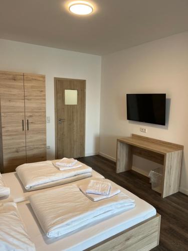 Postel nebo postele na pokoji v ubytování NB Apartments