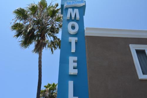 a blue and white sign on a building at Seaside Motel in Redondo Beach