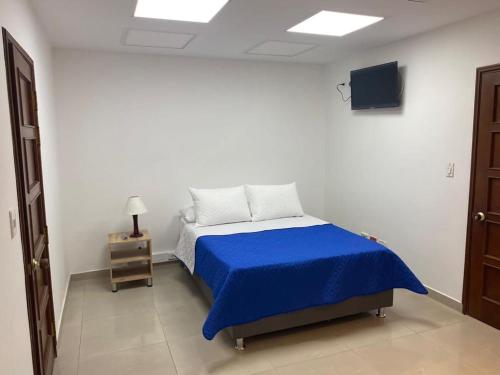 Postel nebo postele na pokoji v ubytování Aparta Hotel Montealegre