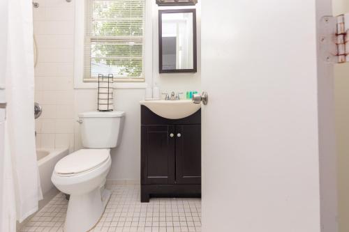 a bathroom with a toilet and a sink at Studio Las Olas Beach - Fort Lauderdale - 5 minutes walk to beach in Fort Lauderdale