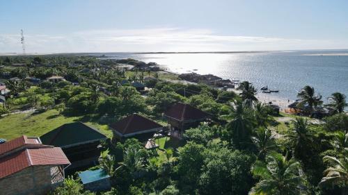 an aerial view of a resort and the ocean at Atins Bangalôs in Atins
