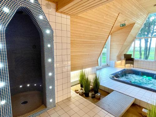 a large bathroom with a large tub in a room at Kosmonautika Puhkekeskus in Kabli