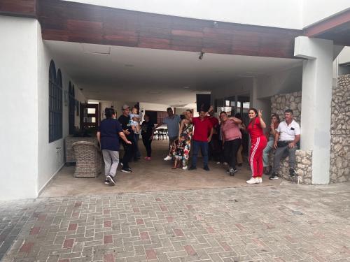 a group of people standing outside of a building at Boca Simon Vacation Curacao in Willemstad