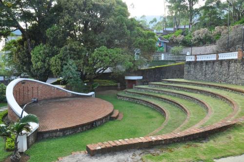 a set of amphitheater seats in a park at Mountain Club Resort Munnar in Chinnakanal