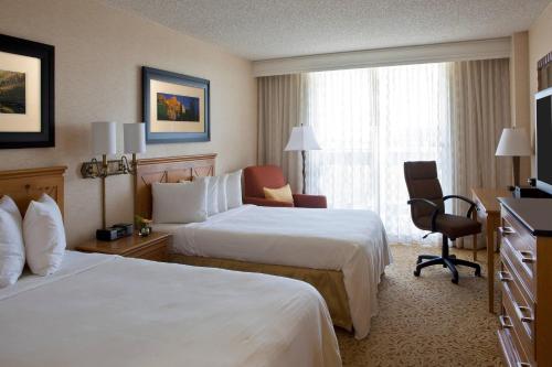 a hotel room with two beds and a window at Denver Marriott West in Golden