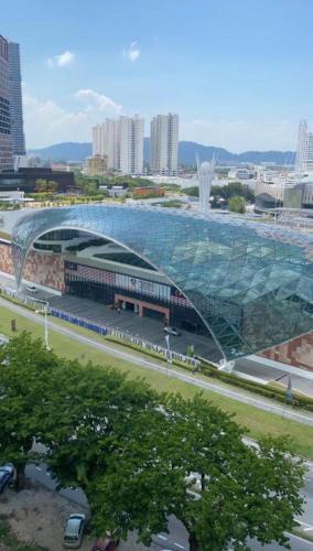a large building with a glass roof in a city at Spice Arena Guesthouse in Bayan Lepas