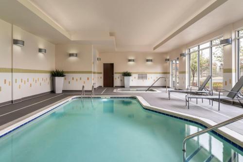 a pool with blue water in a hotel room at Fairfield Inn & Suites by Marriott Akron Fairlawn in Montrose