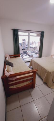 Tempat tidur dalam kamar di Paraná Parque