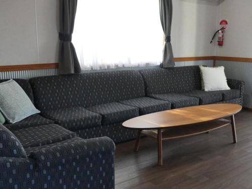 a living room with a couch and a coffee table at Moama Riverside Holiday Park in Moama