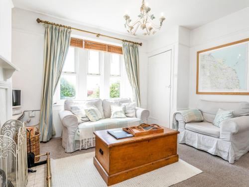 a living room with a couch and a coffee table at Elliot Cottage in Bamburgh