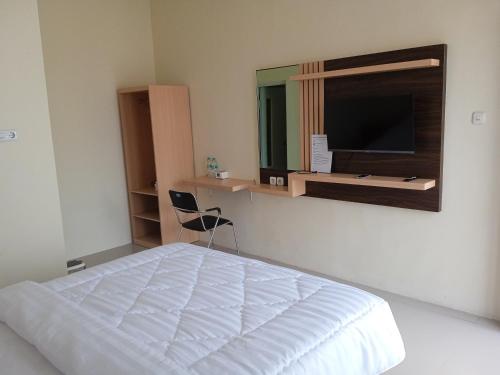 Giường trong phòng chung tại Ni_Er Guesthouse by Mr.Tsabalala