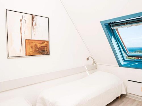 a bedroom with a bed and a window at 6 person holiday home in Allinge in Allinge