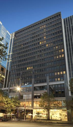 a large office building with a lot of windows at Oaks Melbourne on Collins Suites in Melbourne