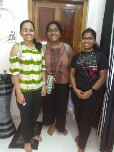 a group of three women posing for a picture at CLIFF HEAVEN in Varkala