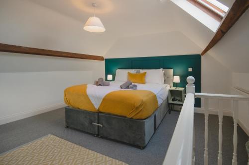 Tempat tidur dalam kamar di Lovely Stone Cottage In The Heart Of Adderbury