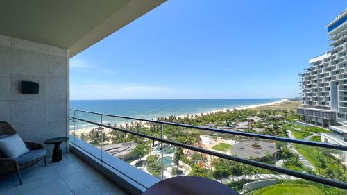 a view of the beach from the balcony of a condo at New World Hoiana Beach Resort in Hoi An