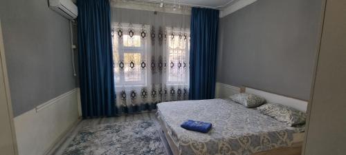 Ένα ή περισσότερα κρεβάτια σε δωμάτιο στο Deluxe