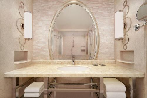 a bathroom with a sink and a mirror at Sheraton Xi'an Hotel in Xi'an