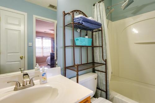 a bathroom with a sink and a toilet and a shower at Horn Lake Vacation Rental about 14 Mi to Memphis! in Horn Lake