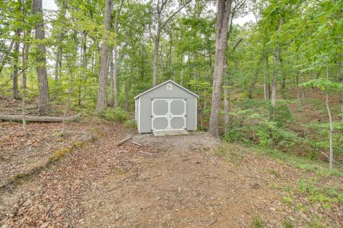 a small dog house in the middle of the woods at Cozy Home in Star Tannery with Private Backyard! in Gravel Springs