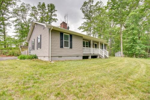a white house with a lawn in front of it at Cozy Home in Star Tannery with Private Backyard! in Gravel Springs
