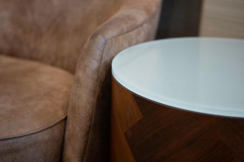 a close up of a table next to a chair at Courtyard by Marriott San Diego Del Mar/Solana Beach in Solana Beach