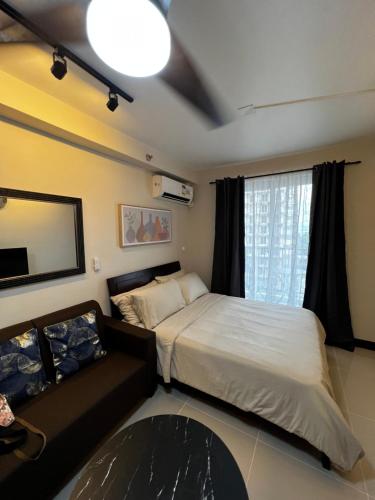 Postel nebo postele na pokoji v ubytování Cozy Studio Apartment